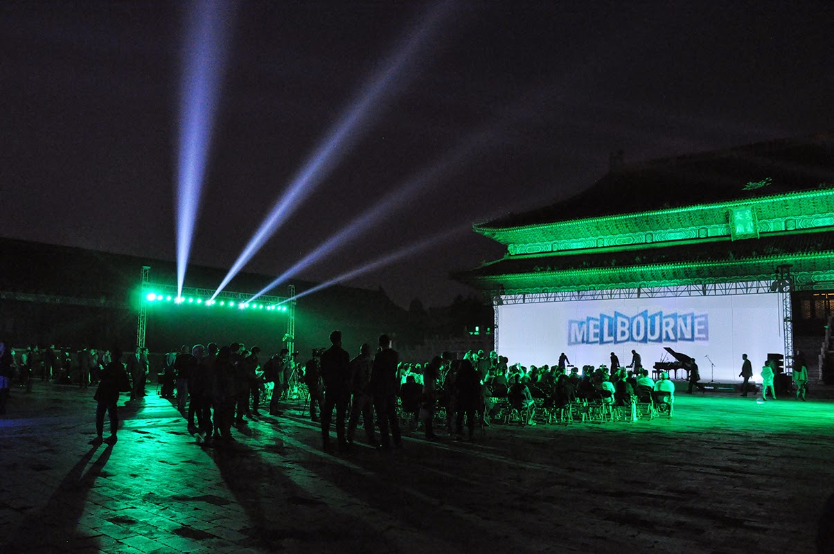 Forbidden City palace washed in green light with Melbourne projection screen